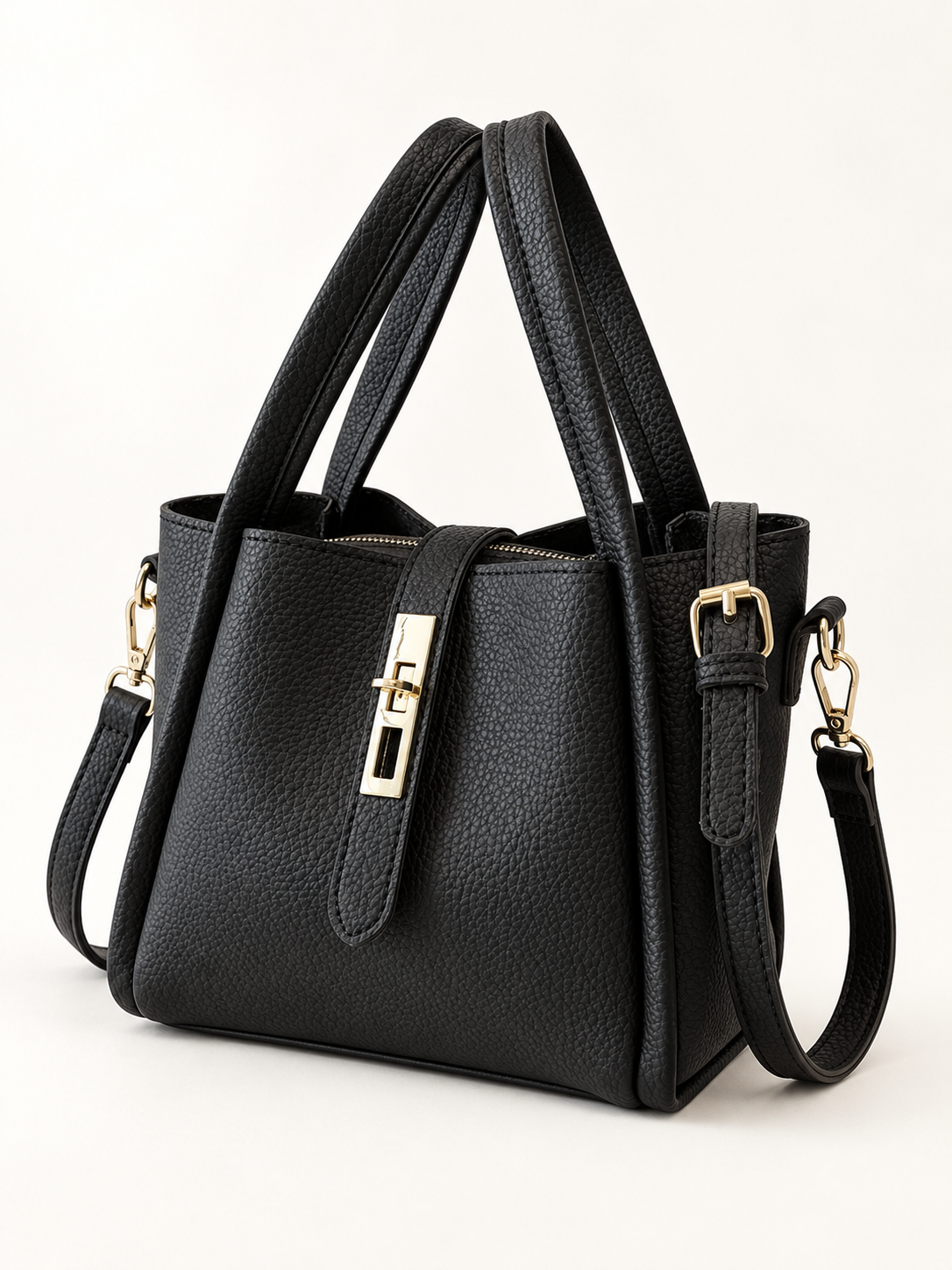Maven Bucket Crossbody Bag in Black — studio view showing material and hardware.