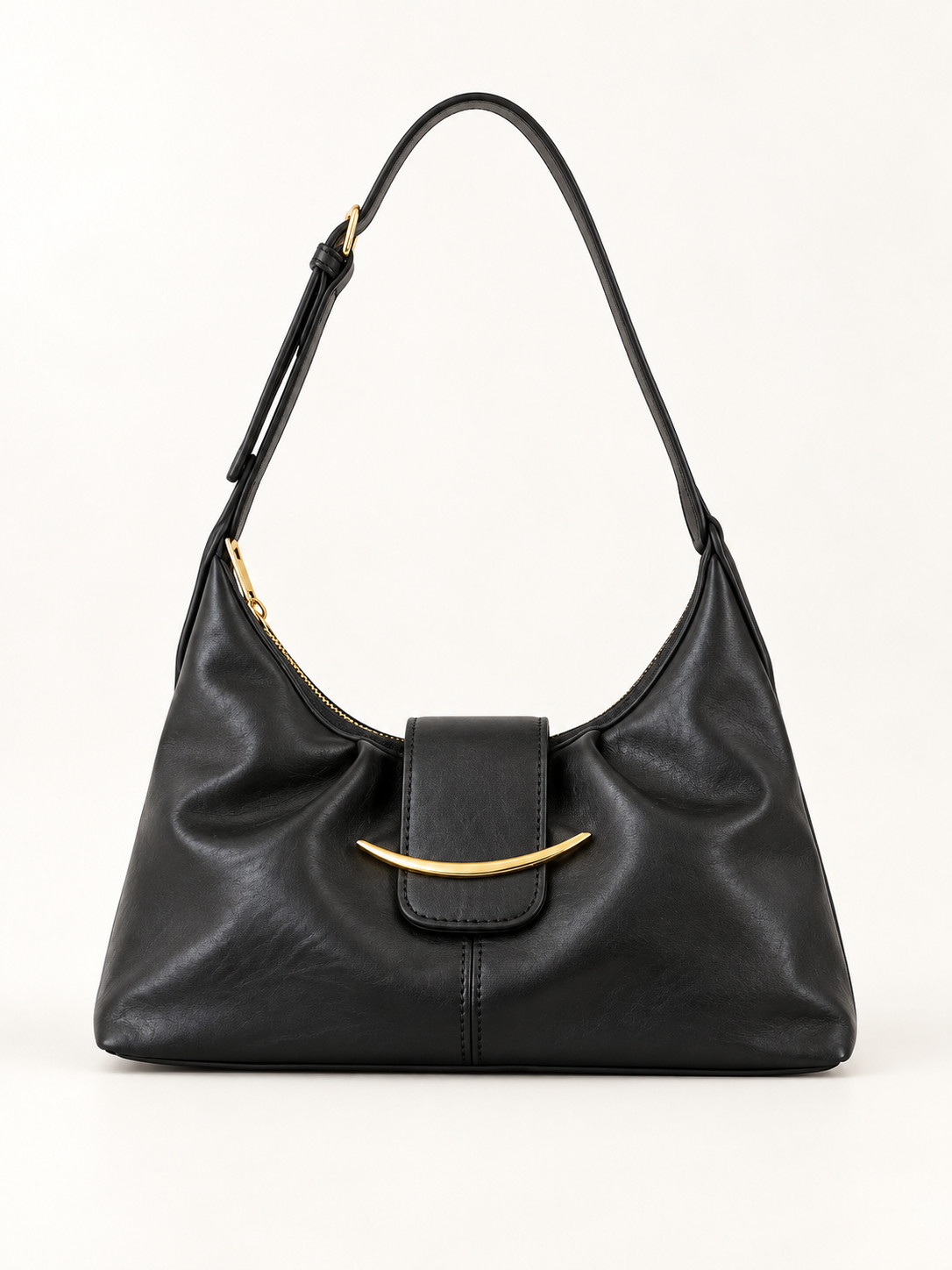 Maven Buckle Crossbody Bag in Black — studio view showing material and hardware.