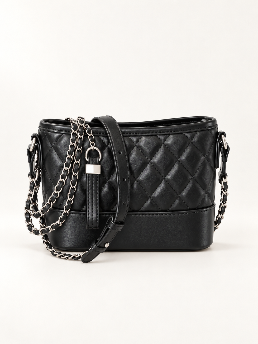 Maven Quilted Bucket Bag in Black — studio view showing material and hardware.