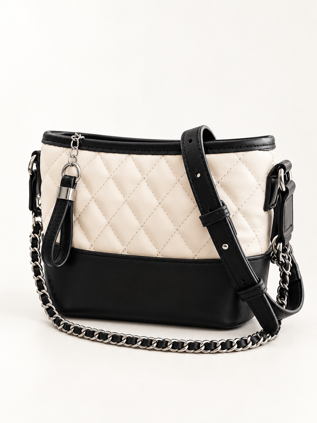 Maven Quilted Bucket Bag in White — studio view showing material and hardware.