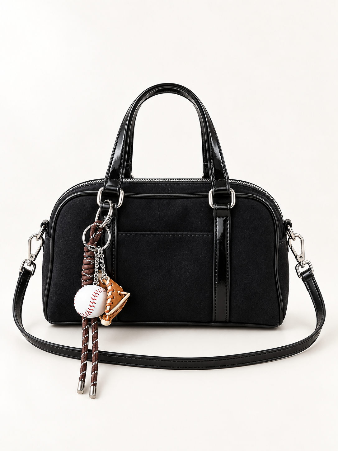 Maven Suede Buckle Crossbody in Black — studio view showing material and hardware.