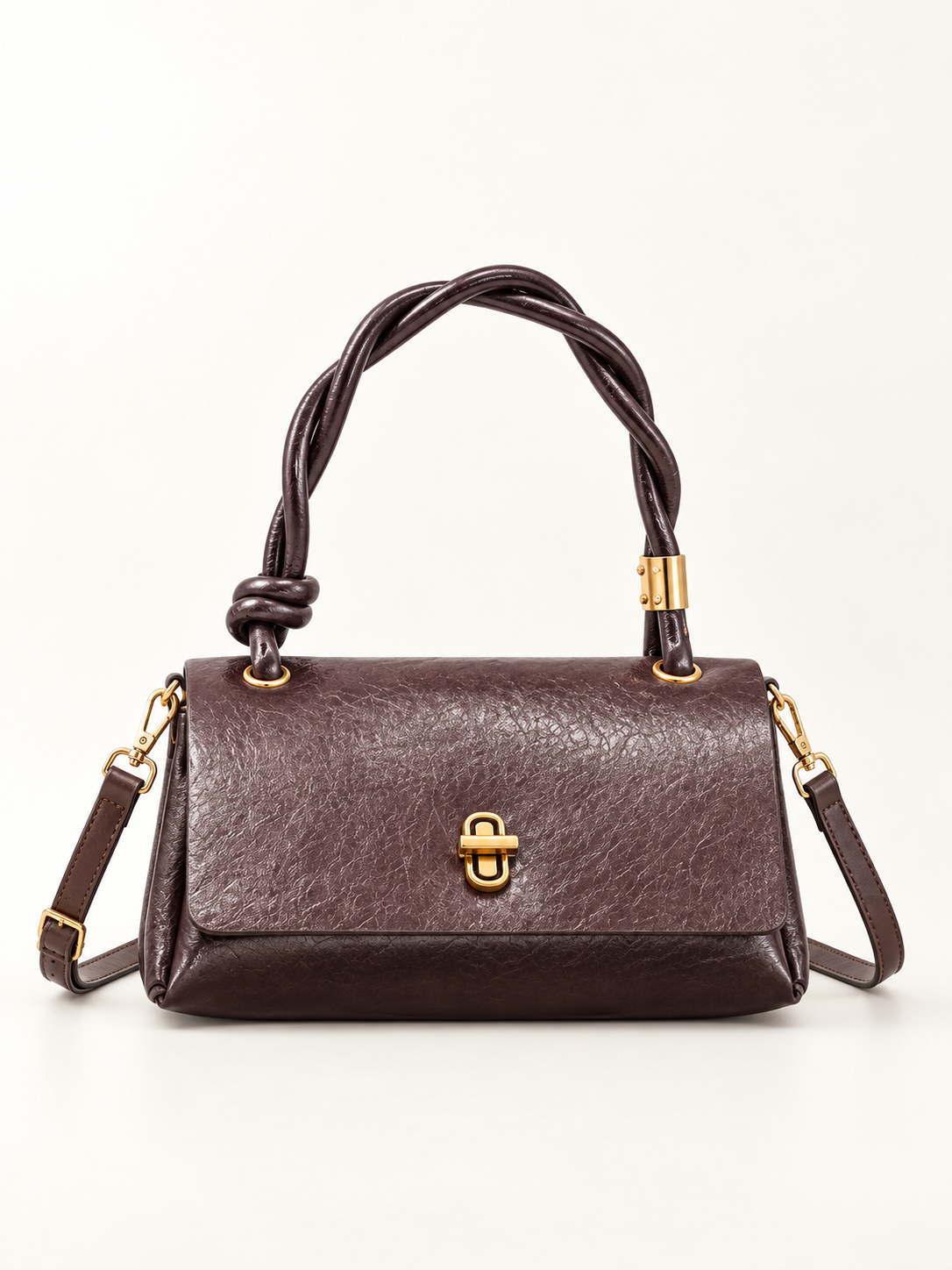 Maven Twisted Handle Crossbody in Brown — studio view showing material and hardware.