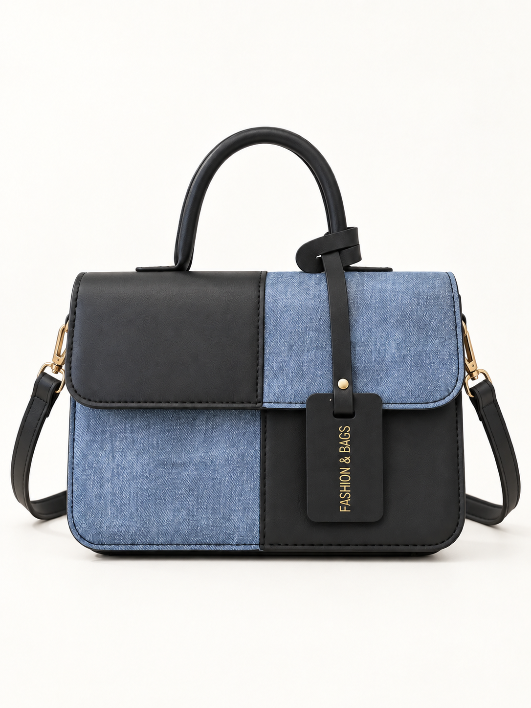 Maven Two-Tone Crossbody Bag in Black — studio view showing material and hardware.
